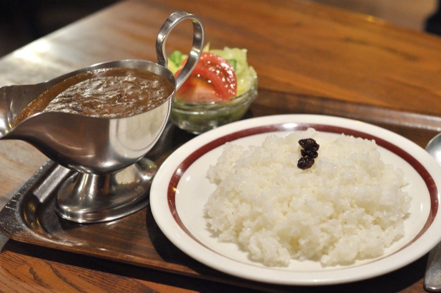 Rice and curry laid out on the long table